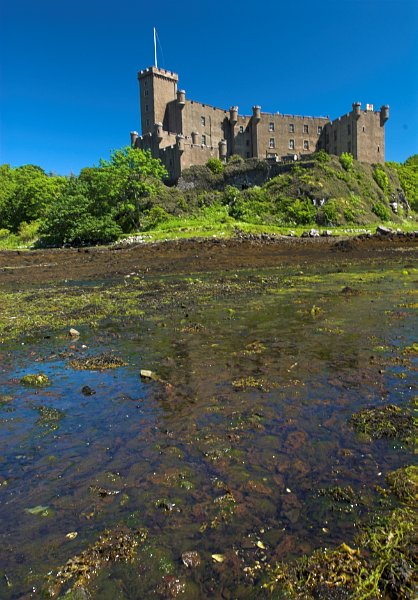 Dunvegan Castle seen from the shore. Photo taken on the Isle of Skye, Scotland. Part of the Britain Express Travel and Heritage Guide.