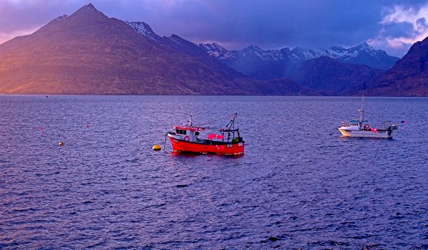 Fishing boats in the harbour at Elgol with the Cuillin Hills in the background. Stock photo of the coast at Elgol on the Isle of Skye, Scotland. Part of the Britain Express Travel and Heritage Picture Library, Scotland collection.