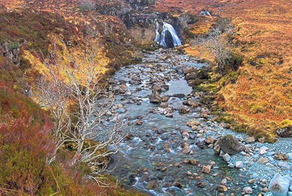 The path to the Fairy Pools follows the stream - Alt Coir' a' Mhadaidh. Stock photo of the Fairy Pools on the Isle of Skye, Scotland. Part of the Britain Express Travel and Heritage Picture Library, Scotland collection.