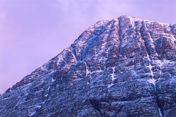 The Cuillin Hills turn a deep red at sunset. Stock photo of the Cuillin Hills taken in Glen Brittle - Isle of Skye, Scotland. Part of the Britain Express Travel and Heritage Picture Library, Scotland collection.