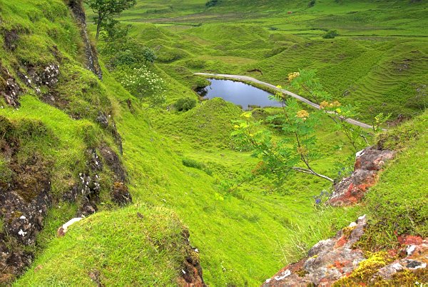 The magical Fairy Glen dressed in many shades of green. This is the view from Castle Ewen towards the road. Stock photo of the Fairy Glen on the Isle of Skye, Scotland. Part of the Britain Express Travel and Heritage Picture Library, Scotland collection.