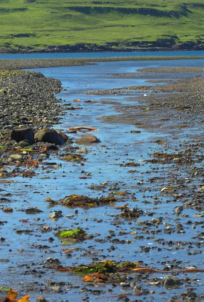 The River Brittle reaches the sea at Glenbrittle. Stock photo of the coast at Glenbrittle on the Isle of Skye, Scotland. Part of the Britain Express Travel and Heritage Picture Library, Scotland collection.