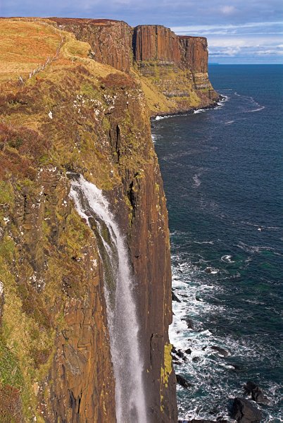 The Mealt waterfall spills down to the sea at Kilt Rock. Stock photo of Kilt Rock on the Isle of Skye, Scotland. Part of the Britain Express Travel and Heritage Picture Library, Scotland collection.