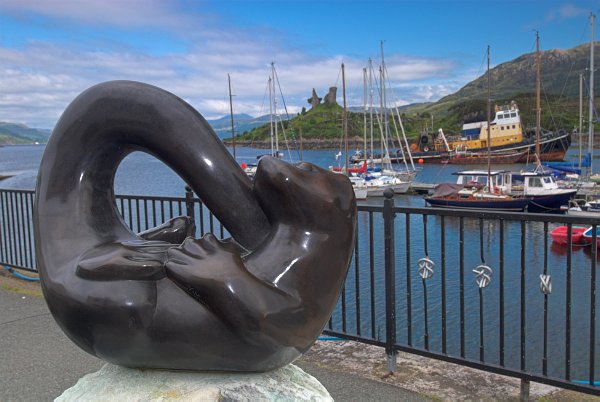 The pretty harbour at Kyleakin, with an otter statue to remind us that this is 'Ring of Bright Water' territory! Stock photo of Kyleakin on the Isle of Skye, Scotland. Part of the Britain Express Travel and Heritage Picture Library, Scotland collection.