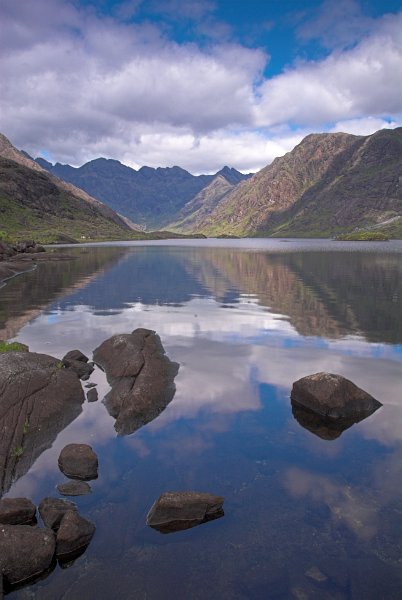 The Black Cuillins reflected in Loch Coriusk. Stock photo of Loch Coriusk on the Isle of Skye, Scotland. Part of the Britain Express Travel and Heritage Picture Library, Scotland collection.