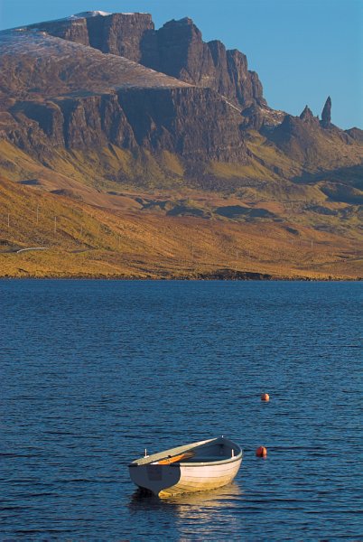 The Old Man of Storr is the dramatic backdrop to Loch Leathan. Stock photo of the Old Man of Storr on the Isle of Skye, Scotland. Part of the Britain Express Travel and Heritage Picture Library, Scotland collection.