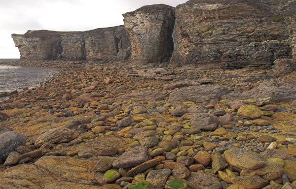 The cliffs that contain Prince Charlie's Cave, near Elgol. Bonnie Prince Charlie hid from the English in caves accessible only at low tide. Stock photo of Prince Charlie's Cave on the Isle of Skye, Scotland. Part of the Britain Express Travel and Heritage Picture Library, Scotland collection.