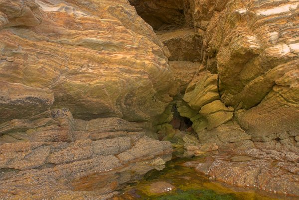 Rock formed into waves at Prince Charlie's Cave near Elgol. Stock photo of Prince Charlie's Cave on the Isle of Skye, Scotland. Part of the Britain Express Travel and Heritage Picture Library, Scotland collection.