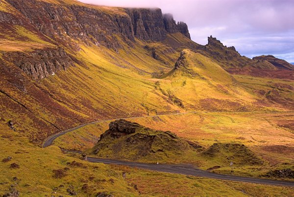 The view looking north along the Quiraing with the A855 winding through the landscape below the cliffs. Stock photo of the Quiraing on the Isle of Skye, Scotland. Part of the Britain Express Travel and Heritage Picture Library, Scotland collection.