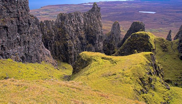 The pinnacles of the Quiraing, and beyond them, the sea. Stock photo of the coast at Staffin on the Isle of Skye, Scotland. Part of the Britain Express Travel and Heritage Picture Library, Scotland collection.