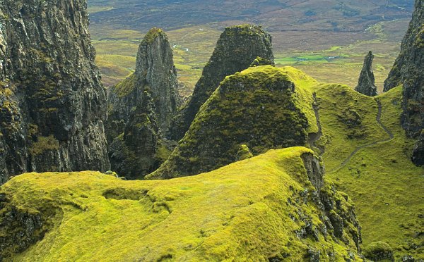 Several pinnacles can be seen at once from the mossy edges of 'The Table'. Stock photo of the Quiraing on the Isle of Skye, Scotland. Part of the Britain Express Travel and Heritage Picture Library, Scotland collection.