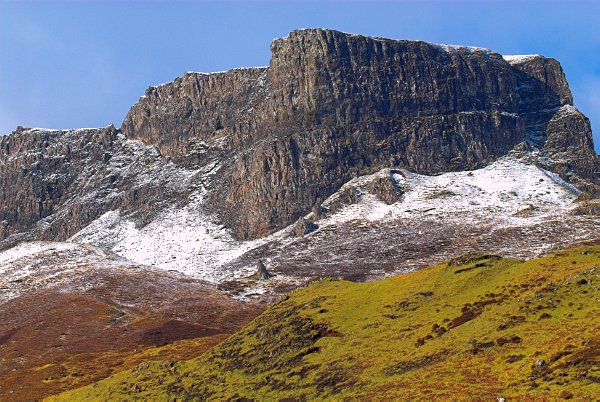 The escarpment of the Trotternish Ridge on a wintry day. Photo of the Trotternish Ridge near Staffin on the Isle of Skye, Scotland.