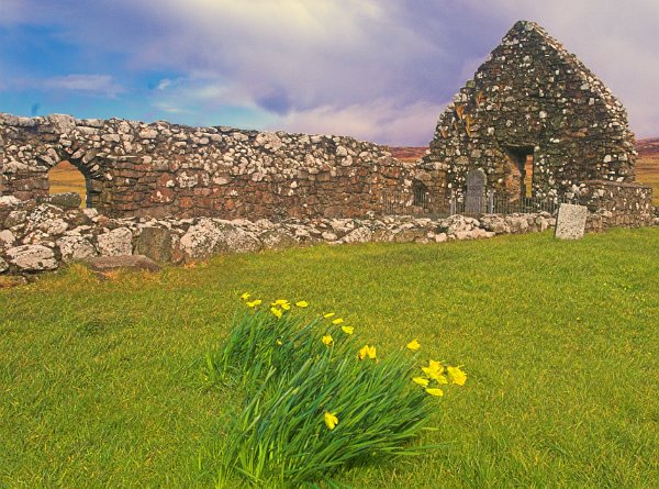 In the medieval period this peaceful churchyard was the scene of a terrible massacre and battle between the MacDonalds and MacLeods. Photo of Trumpan on the Isle of Skye, Scotland.